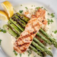 Grilled Salmon · Grilled Atlantic salmon served with basmati rice, grilled asparagus, and a lemon butter sauce