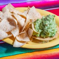 Guacamole Con Tostadas · A mexican dip made with ripe avocados, fresh tomatoes, onions and cilantro. Served in a bowl...