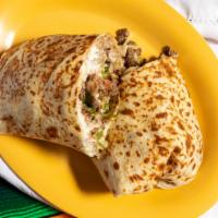 Famous Burrito · Steak, sour cream, cheese, lettuce, tomatoes and beans.