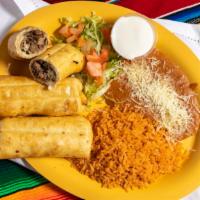 Chimichangas Dinner · Three fried flour tortillas filled with cheese and your choice of chicken, steak, ground bee...