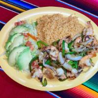 Camarones A La Plancha · Grilled Shrimp cooked over poblano peppers and unions. Served with rice and salad