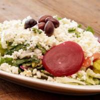 Greek Salad · Romaine lettuce with beets, olives, onions, shredded cabbage and carrots, cucumbers, tomatoe...