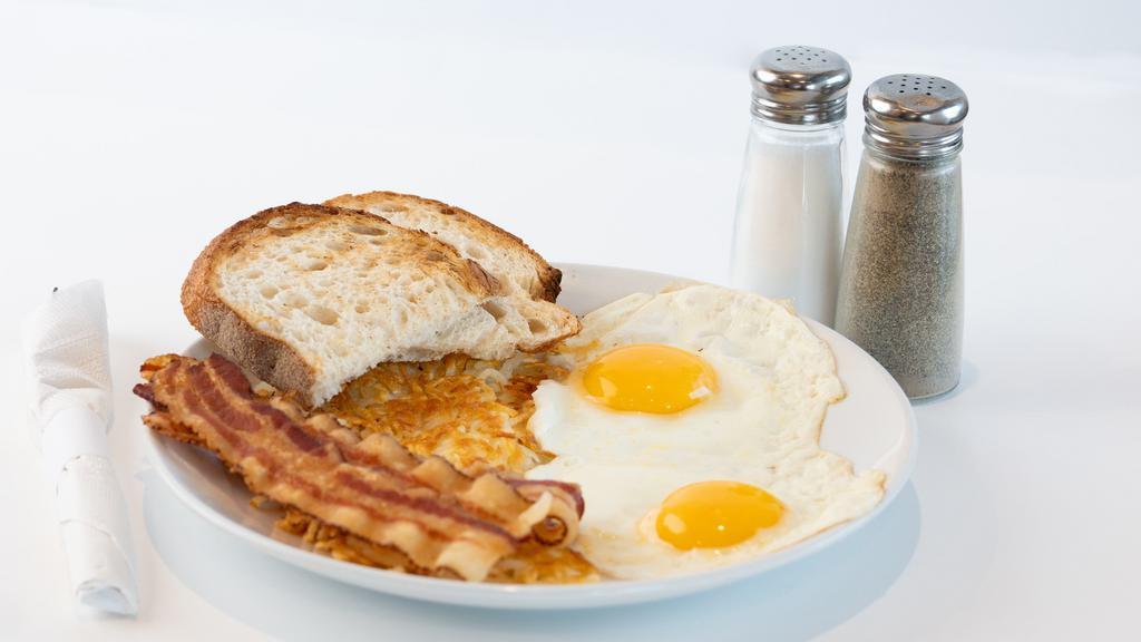 Big Bite Breakfast · Two eggs, choice of bacon, sausage or ham, choice of side and toast.