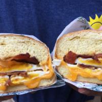 Big Breakfast Sandwich · Big breakfast sandwich two over-hard eggs, bacon, cheddar and chipotle mayo on a toasted bri...