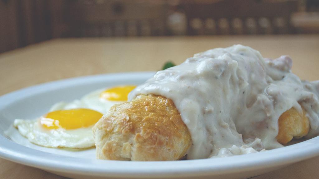 Stuffed Biscuit & Gravy · Stuffed biscuit and gravy a giant fresh baked biscuit stuffed with sausage, peppers, onions and cheese. Topped with gravy, served with two eggs. (Item cannot be customized, the loaves are pre-baked.)