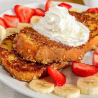 French Toast Crunch · French toast coated with a sweet granola-crunch, strawberries, bananas, and whipped cream.