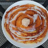 Cinnamon Roll Pancakes · Two stack of our famous pancakes baked with a cinnamon swirl sauce, and topped with maple gl...