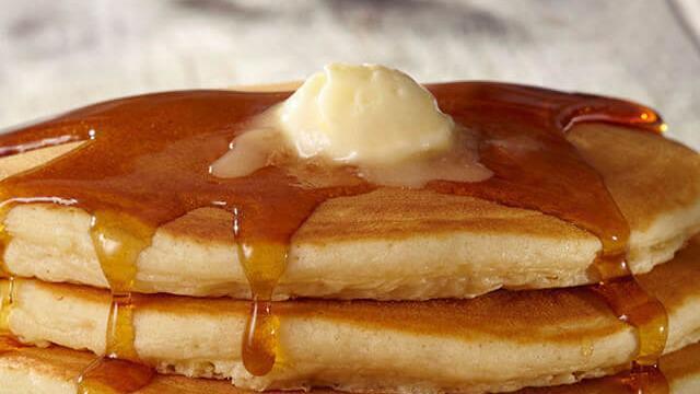 Buttermilk Pancakes · Two stack of our famous big-as-the-plate buttermilk pancakes.