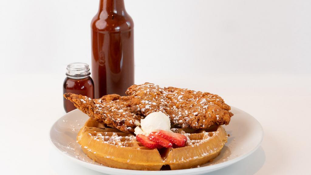 Chicken & Waffles · Our Hand breaded Fried Chicken on top a Golden brown Belgian Waffle topped with Honey Butter.