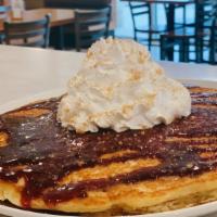 Wildberry Crumble Pancakes · Blueberries, Streusel, Homemade Berry Jam & Whipped Topping