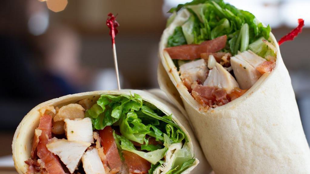 Monterey Ranch Chicken Wrap · Crispy or grilled chicken breast, Monterey jack cheese, bacon, lettuce, tomato and a side of house ranch.