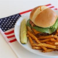 Bistro Burger · Grilled black angus burger, cheddar, lettuce, tomato and herb mayo on a brioche bun.
