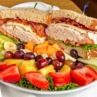 Southwest Turkey Club · Oven-roasted turkey stacked high on whole grain wheat. Bacon, jack cheese, lettuce, tomato a...