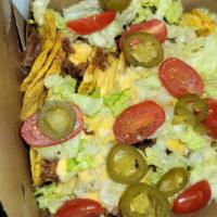 Nachos Supreme · Choice of pulled pork or chopped jerk chicken. Includes tortilla or Doritos chips, melted ch...