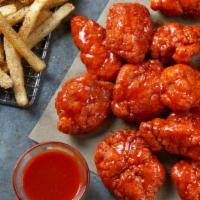 Boneless Wings
 · Boneless Wings tossed in your choice of sauce, served with seasoned fries and your choice of...