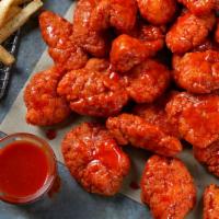 Boneless Wings · Boneless Wings tossed in your choice of sauces and served with Ranch or Blue Cheese.