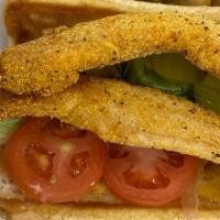 Catfish Po'Boy · Served on fresh french bread crispy lettuce pickles tomatoes and our house-made remoulade sa...