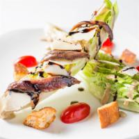 Classic Caesar · Romaine Hearts, Tomatoes, Anchovies, Croutons, Balsamic Glaze, Caesar Dressing.