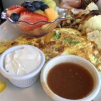 California Omelette · Three eggs with avocado, bacon, tomato, and pepper jack cheese. Served with salsa and sour c...