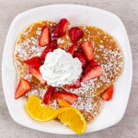 Fresh Strawberry Pancakes · Topped with strawberry sauce, and whipped cream.
