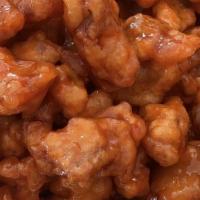 Orange Chicken / 陈皮鸡 · Deep fried chunks of chicken sautéed in a sweet and sour sauce flavored with orange peels.