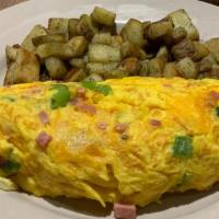 Denver Omelette · Smoked ham, house-roasted onions, green peppers, and melted jack and cheddar cheese.