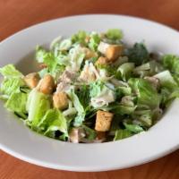 Chicken Caesar Salad · Fresh romaine topped with grilled chicken, croutons and Parmesan cheese. Tossed in our Caesa...
