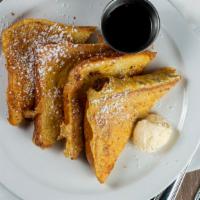 French Toast · Four pieces of custard-battered french toast, topped with butter, a dusting of powdered suga...