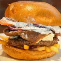 Greek Freak Burger · Our signature angus beef burger topped with shaved gyro meat, feta cheese, family recipe tza...