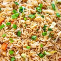 Vegetable Fried Rice · Aromatic rice stir-fried with finely chopped cabbage, carrots, and bell pepper.