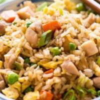 Chicken Fried Rice · Aromatic rice stir-fried with finely chopped cabbage, carrots, bell pepper, and chicken.