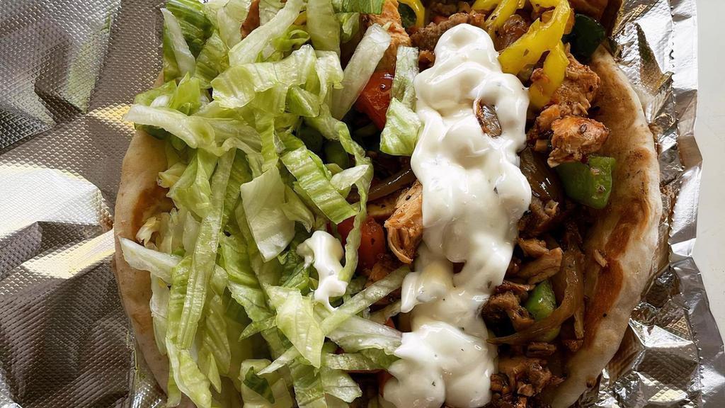 Chicken Gyro · Topping choices:
Onion, tomato, green and banana peppers, lettuce and
Tzatziki / cucumber sauce.