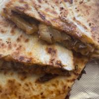 Steak Quesadilla · Topping choices:
Onion, green peppers, mushrooms, mozzarella cheese and Sour cream.