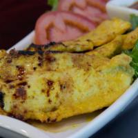 Chicken Satay · Charcoal grilled chicken tenders on skewers, marinated with Thai spices and served with pean...