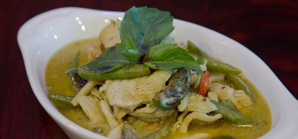 Green Curry · Bamboo shoots, broccoli, peas, zucchini, mushrooms, green peppers, green beans and basil. Served with white rice. Spicy.