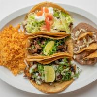 Taco Dinner · Three tacos on flour or corn tortillas with onion and cilantro and your choice of meat.