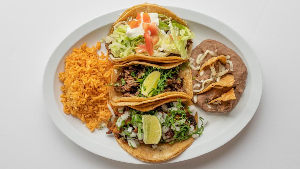 Taco Dinner · Three tacos on flour or corn tortillas with onion and cilantro and your choice of meat.