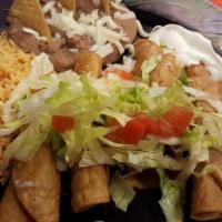Flautas · Four corn tortillas rolled and filled with chicken lightly fried and garnished with sour cre...