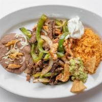 Fajitas Mixtas · Tender strips of grilled steak and chicken mixed with sautéed onion bell peppers.