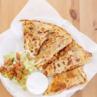 Quesadillas · Flour tortilla with melted cheese and your choice of meat.