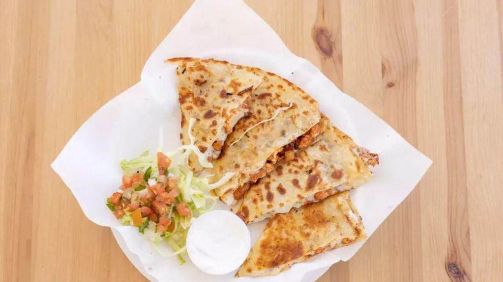 Quesadillas · Flour tortilla with melted cheese and your choice of meat.