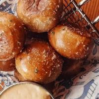 Soft Pretzel Bites · MKE Pretzel Company bites dusted in butter and garlic parmesan with bier cheese aioli