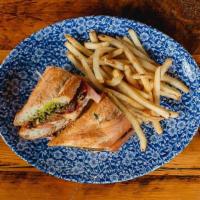 Brie Tomato Basil · Roasted Roma tomatoes, garlic aioli, broiled brie. cheese, basil pesto, toasted baguette