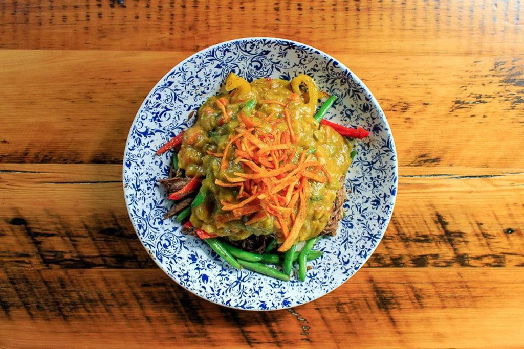 Indo Beef Curry · Shredded beef, green beans, sweet peppers,. spiced coconut curry sauce, braised spinach,. potato kripick, brown rice and pepper medley
