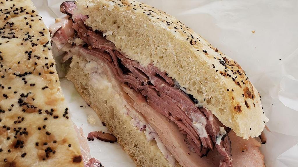 Roosevelt Sandwich · Kosher - pork free; no cheese and meat together. Served with 1/2 lb. of turkey and pastrami. A hot and tasty solution for your hunger, our famed Roosevelt is turkey and pastrami piled for your pleasure. 1/3 pound of meat sure to satisfy!