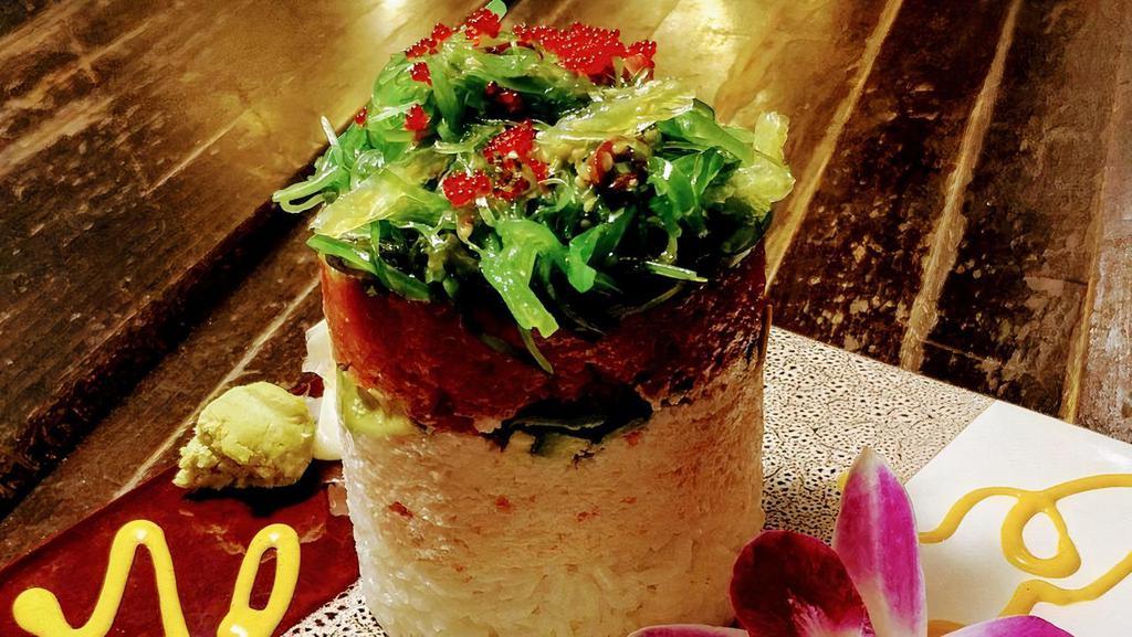 Sushi Tower · Spicy cut tuna mixed, layer of rice, crab mix, avocado, seaweed salad, scallions, sesame seeds, spicy mayo and masago