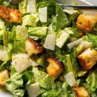 Classic Caesar Salad · Romaine, caesar dressing, croutons & shaved parmesan, includes garlic toast