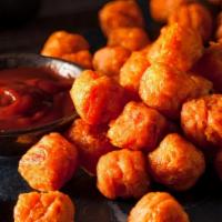 Sweet Potato Tots · Basket of sweet potato tots served with chipotle sour cream