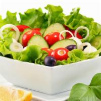 Arabic Salad · Chopped lettuce, tomatoes, cucumbers, onion, dressed with fresh lemon and olive oil.