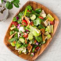 Fattoush Salad · Chopped lettuce, tomatoes, cucumbers, onion, parsley and mint, mixed with baked pita chips a...